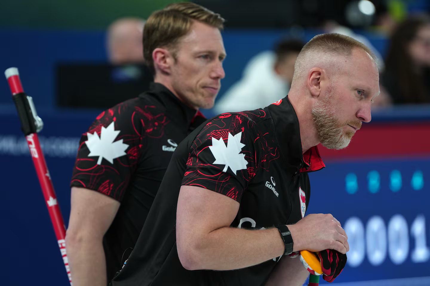 Canada's Brad Jacobs and Marc Kennedy in action during the men's curling round robin session against Sweden, at the 2026 Winter Olympics, in Cortina d'Ampezzo, Italy, on Feb. 13, 2026.