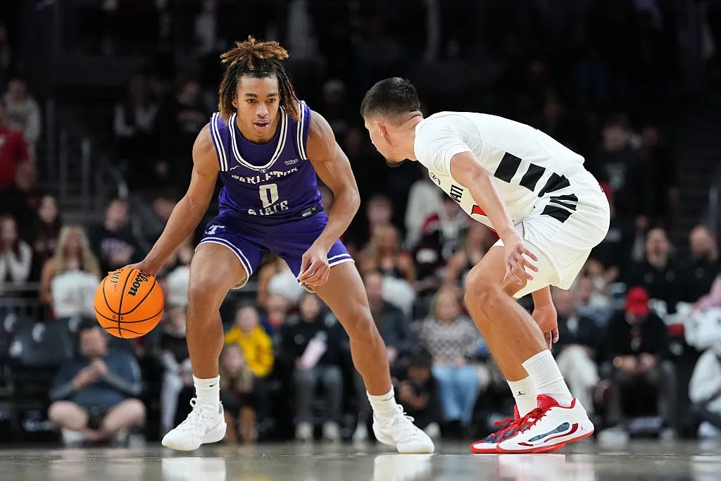 CINCINNATI, OHIO - DECEMBER 01: Jordan Mizell #0 of the Tarleton State Texans dribbles the ball while being guarded by Kerr Kriisa #11 of the Cincinnati Bearcats in the second half at Fifth Third Arena on December 01, 2025 in Cincinnati, Ohio. (Photo by Dylan Buell/Getty Images)